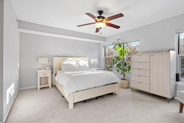 660 2nd St Unit 104, Minneapolis, MN 55401 - bedroom with multiple windows, light carpet, and ceiling fan