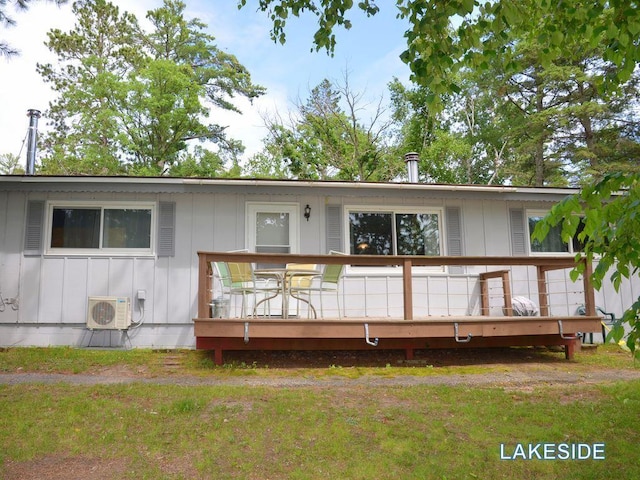 26315 Icon Dr Unit 103, Park Rapids, MN 56470 - rear view of house with a deck, board and batten siding, and a lawn
