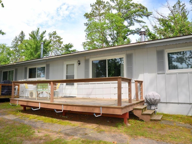 26315 Icon Dr Unit 103, Park Rapids, MN 56470 - back of property with board and batten siding and a wooden deck