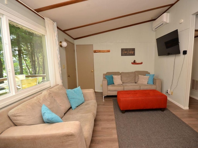 26315 Icon Dr Unit 103, Park Rapids, MN 56470 - living area featuring vaulted ceiling, wood finished floors, and a wall unit AC