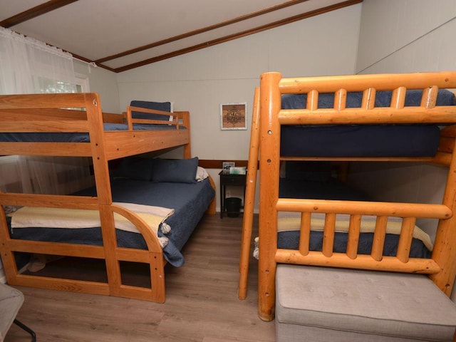 26315 Icon Dr Unit 103, Park Rapids, MN 56470 - bedroom featuring lofted ceiling and wood finished floors