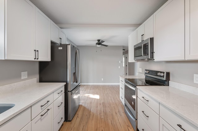 11632 Utah Ave N, Champlin, MN 55316 - kitchen with stainless steel appliances, a ceiling fan, white cabinets, and light wood finished floors