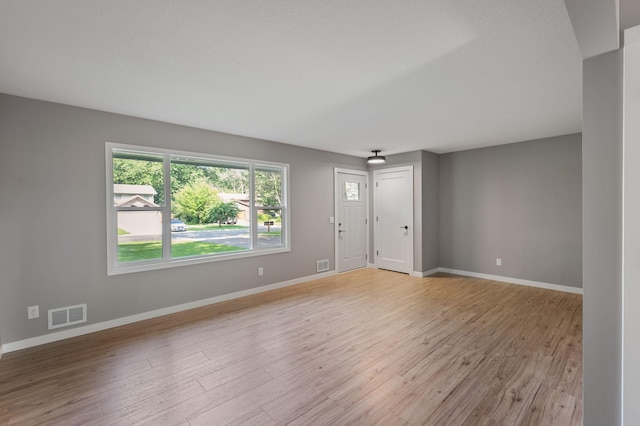 11632 Utah Ave N, Champlin, MN 55316 - spare room featuring light wood-type flooring and baseboards