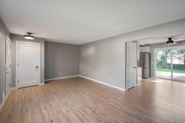11632 Utah Ave N, Champlin, MN 55316 - spare room featuring light wood-style flooring and a ceiling fan