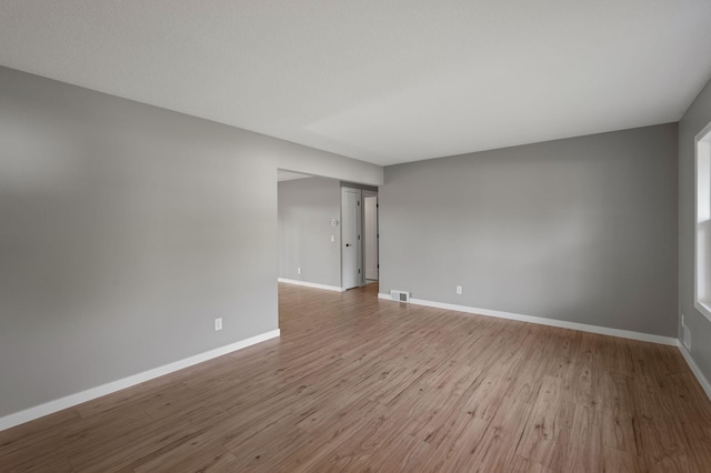 11632 Utah Ave N, Champlin, MN 55316 - spare room featuring wood finished floors and baseboards