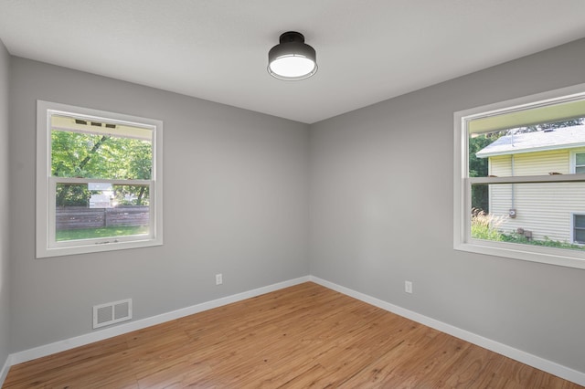 11632 Utah Ave N, Champlin, MN 55316 - unfurnished room with baseboards and light wood-style floors