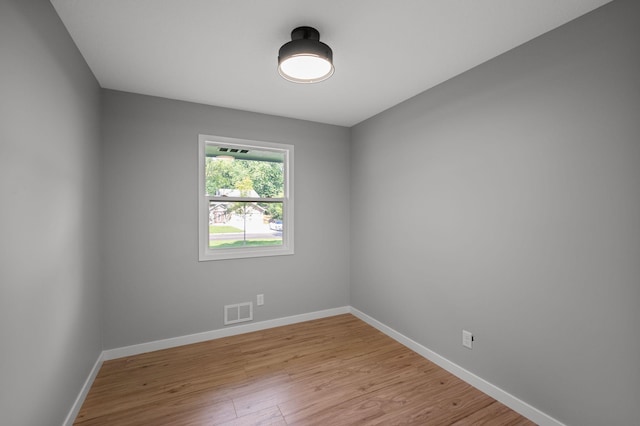 11632 Utah Ave N, Champlin, MN 55316 - empty room featuring light wood finished floors and baseboards