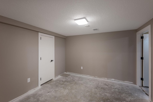 11632 Utah Ave N, Champlin, MN 55316 - unfurnished room featuring a textured ceiling and unfinished concrete flooring