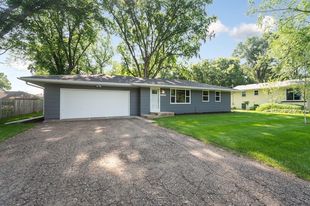 11632 Utah Ave N, Champlin, MN 55316 - ranch-style house featuring asphalt driveway and a garage