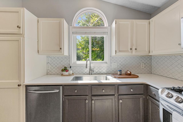 14349 Natchez Ave, Savage, MN 55378 - kitchen featuring dishwasher, white stove, decorative backsplash, light countertops, and lofted ceiling