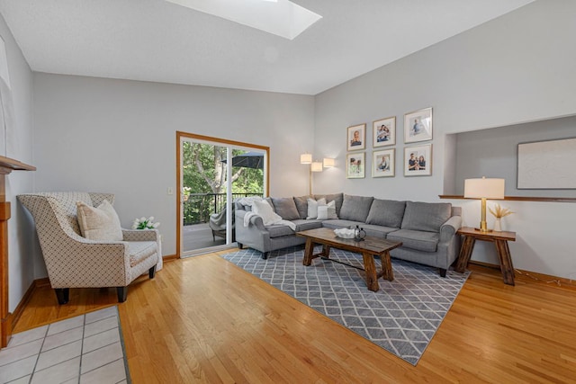 14349 Natchez Ave, Savage, MN 55378 - living room featuring a skylight, light wood-style flooring, and lofted ceiling