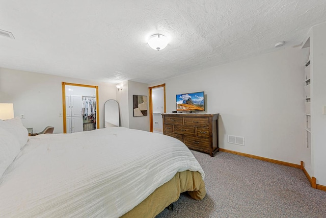 14349 Natchez Ave, Savage, MN 55378 - bedroom with carpet flooring, a textured ceiling, and a walk in closet
