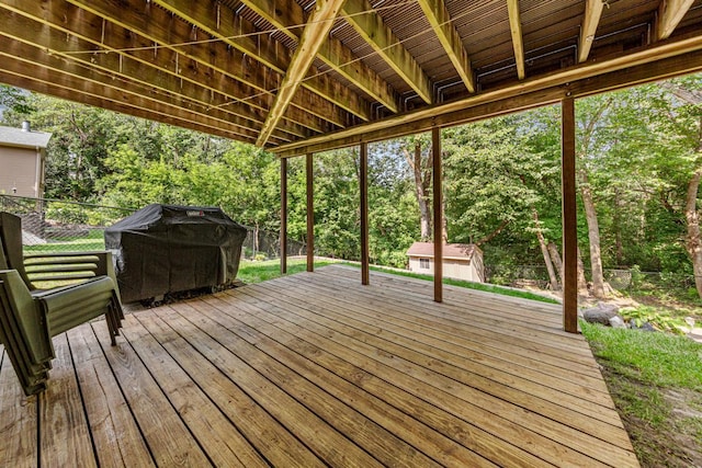 14349 Natchez Ave, Savage, MN 55378 - wooden terrace with a fenced backyard, a storage unit, and view of scattered trees
