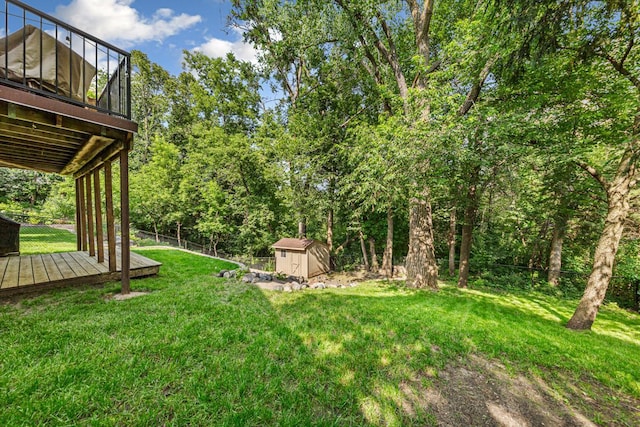 14349 Natchez Ave, Savage, MN 55378 - fenced yard featuring a storage unit and a deck