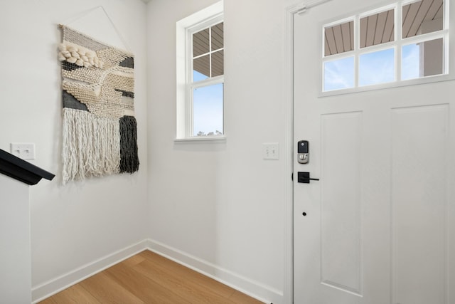 22668 Isla Way, Rogers, MN 55374 - entrance foyer with light wood-type flooring and baseboards