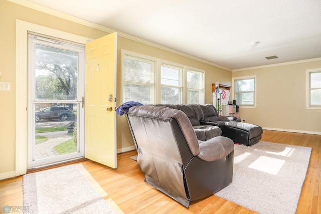 921 16th St S, Fargo, ND 58103 - living room featuring ornamental molding and light wood-style floors
