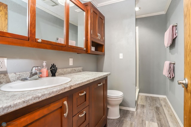 921 16th St S, Fargo, ND 58103 - full bathroom with wood finished floors, vanity, a stall shower, and ornamental molding