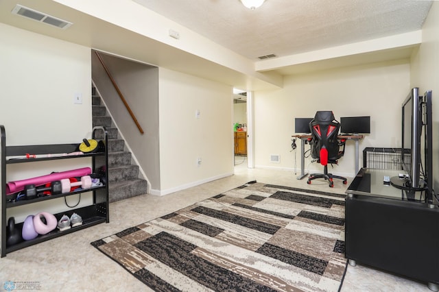 921 16th St S, Fargo, ND 58103 - exercise area featuring carpet floors and a textured ceiling