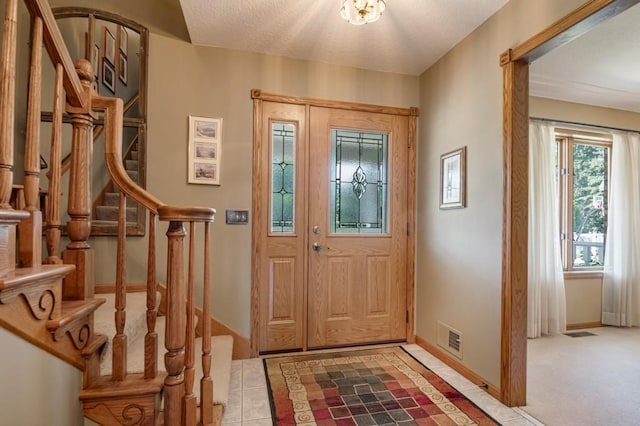 251 Revere Ln N, Champlin, MN 55316 - tiled foyer entrance with stairs and baseboards