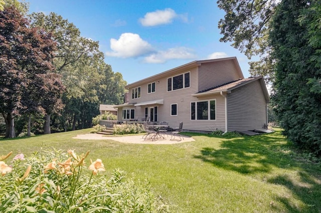 251 Revere Ln N, Champlin, MN 55316 - back of property with a yard and a patio area
