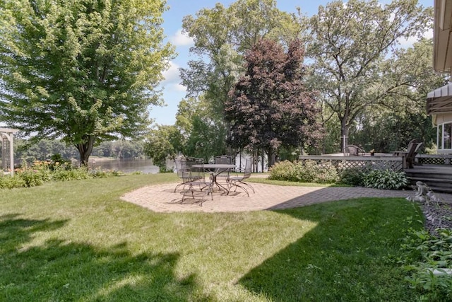 251 Revere Ln N, Champlin, MN 55316 - view of green lawn featuring a patio and a deck with water view