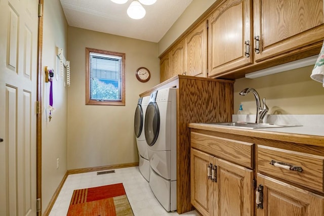 251 Revere Ln N, Champlin, MN 55316 - washroom with separate washer and dryer, cabinet space, and light flooring