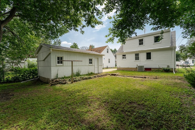 213 11th St SE, Rochester, MN 55904 - rear view of property featuring a yard and an outbuilding