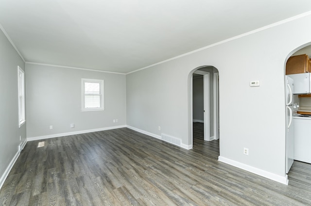 213 11th St SE, Rochester, MN 55904 - empty room featuring arched walkways, dark wood-type flooring, and crown molding