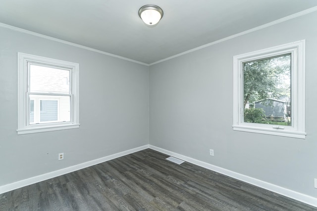 213 11th St SE, Rochester, MN 55904 - spare room featuring plenty of natural light, dark wood-style flooring, and ornamental molding