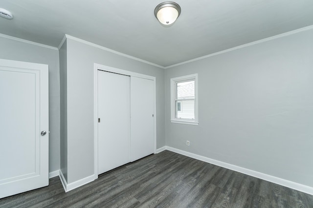 213 11th St SE, Rochester, MN 55904 - unfurnished bedroom with dark wood finished floors, a closet, and crown molding