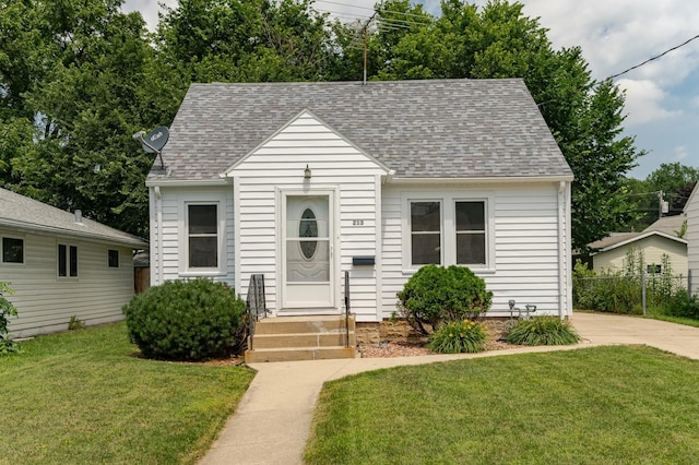 213 11th St SE, Rochester, MN 55904 - view of front facade with a shingled roof