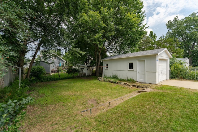 213 11th St SE, Rochester, MN 55904 - view of yard with an outbuilding, driveway, and a garage