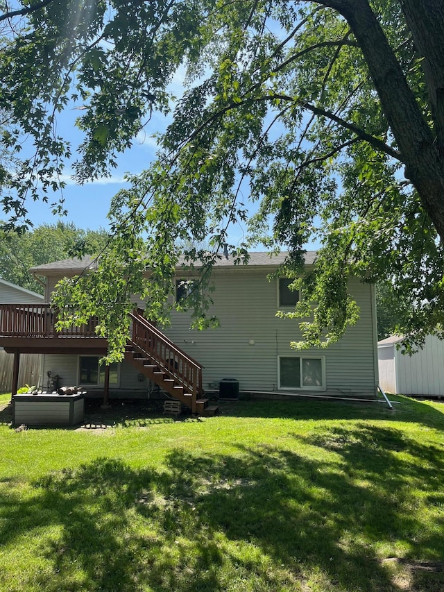 825 10th Ave SW, Forest Lake, MN 55025 - view of grassy yard with stairs and a wooden deck