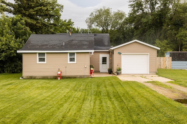 600 1st Ave, Osakis, MN 56360 - back of house featuring driveway, an attached garage, and a shingled roof