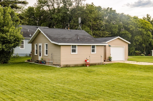 600 1st Ave, Osakis, MN 56360 - view of front of property featuring driveway, roof with shingles, a front lawn, and an attached garage
