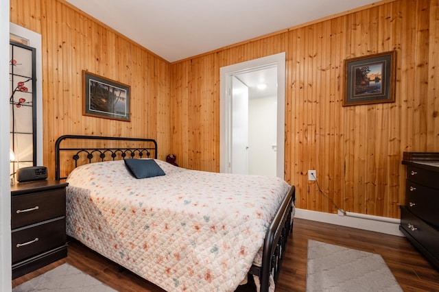 600 1st Ave, Osakis, MN 56360 - bedroom featuring wooden walls and dark wood-type flooring