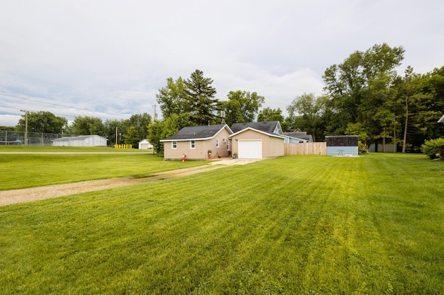 600 1st Ave, Osakis, MN 56360 - view of yard featuring an attached garage and driveway