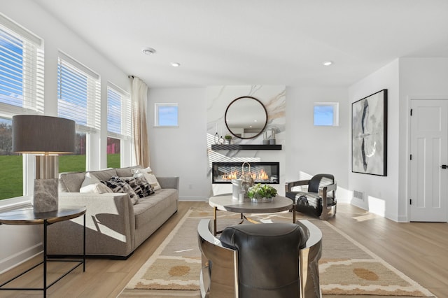 11635 72nd St NE, Otsego, MN 55301 - living area featuring wood finished floors, a fireplace, and recessed lighting