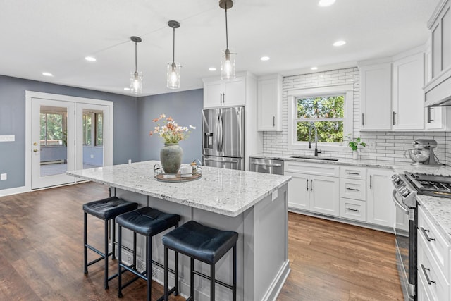16951 88th Ave N, Maple Grove, MN 55311 - kitchen with appliances with stainless steel finishes, plenty of natural light, decorative backsplash, and recessed lighting