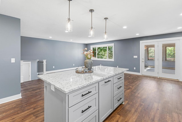 16951 88th Ave N, Maple Grove, MN 55311 - kitchen with dark wood-style floors, a kitchen island, hanging light fixtures, recessed lighting, and light stone counters