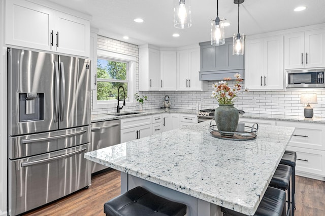 16951 88th Ave N, Maple Grove, MN 55311 - kitchen featuring stainless steel appliances, a kitchen breakfast bar, recessed lighting, and dark wood-type flooring
