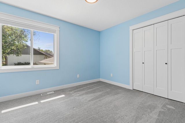16951 88th Ave N, Maple Grove, MN 55311 - unfurnished bedroom featuring carpet flooring and a closet