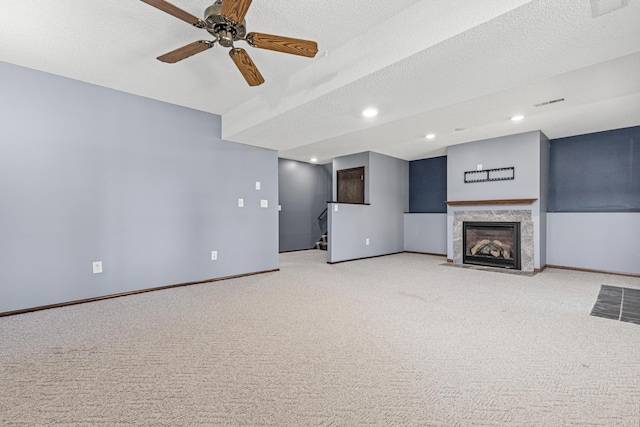 16951 88th Ave N, Maple Grove, MN 55311 - unfurnished living room with carpet flooring, stairway, a fireplace with flush hearth, and a ceiling fan