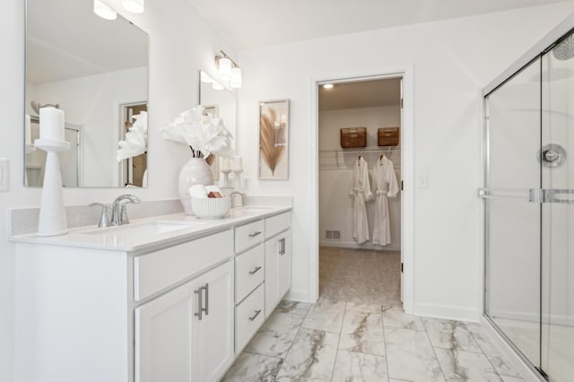 1938 Tamarack Rd, Carver, MN 55315 - bathroom featuring double vanity, marble look tiles, a stall shower, and a spacious closet