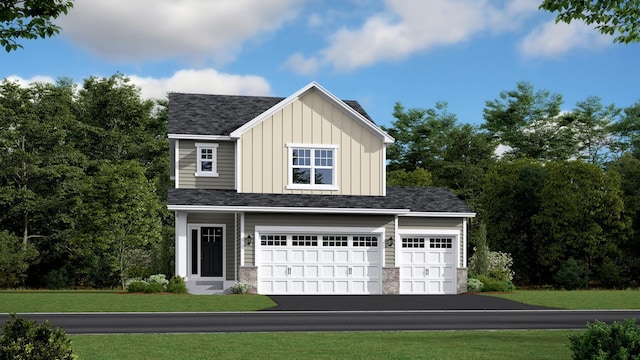 1585 143rd St E, Rosemount, MN 55068 - view of front of home featuring board and batten siding, an attached garage, asphalt driveway, and a shingled roof