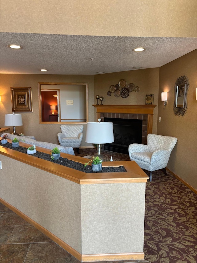 13670 Carrach Ave Unit 214, Rosemount, MN 55068 - living room with a textured ceiling, a tile fireplace, and recessed lighting