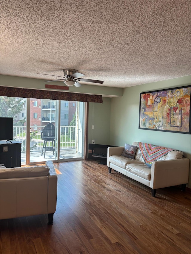 13670 Carrach Ave Unit 214, Rosemount, MN 55068 - living room featuring a textured ceiling, wood finished floors, and a ceiling fan