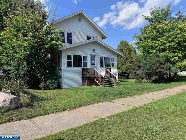 1027 Chapman St, Ely, MN 55731 - view of front of property featuring a front yard
