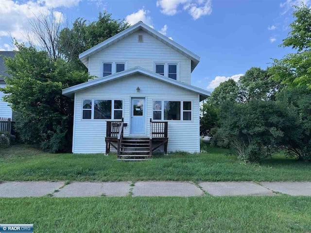 1027 Chapman St, Ely, MN 55731 - view of front of property featuring a front lawn
