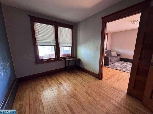 1027 Chapman St, Ely, MN 55731 - unfurnished room featuring hardwood / wood-style flooring and baseboards